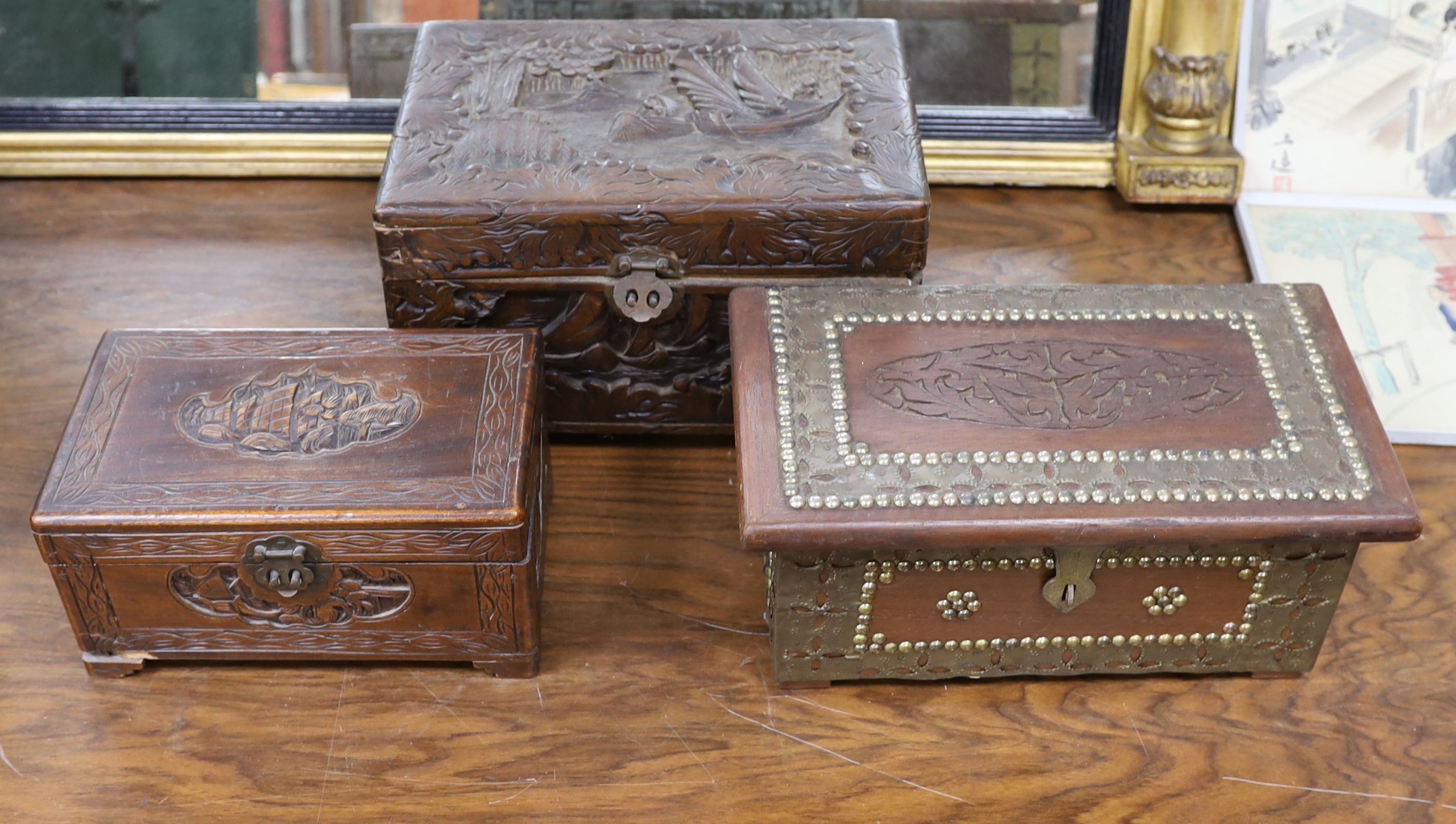 A Chinese carved camhor wood chest and three assorted boxes, Camphor chest 35 cms wide x22 cms high.